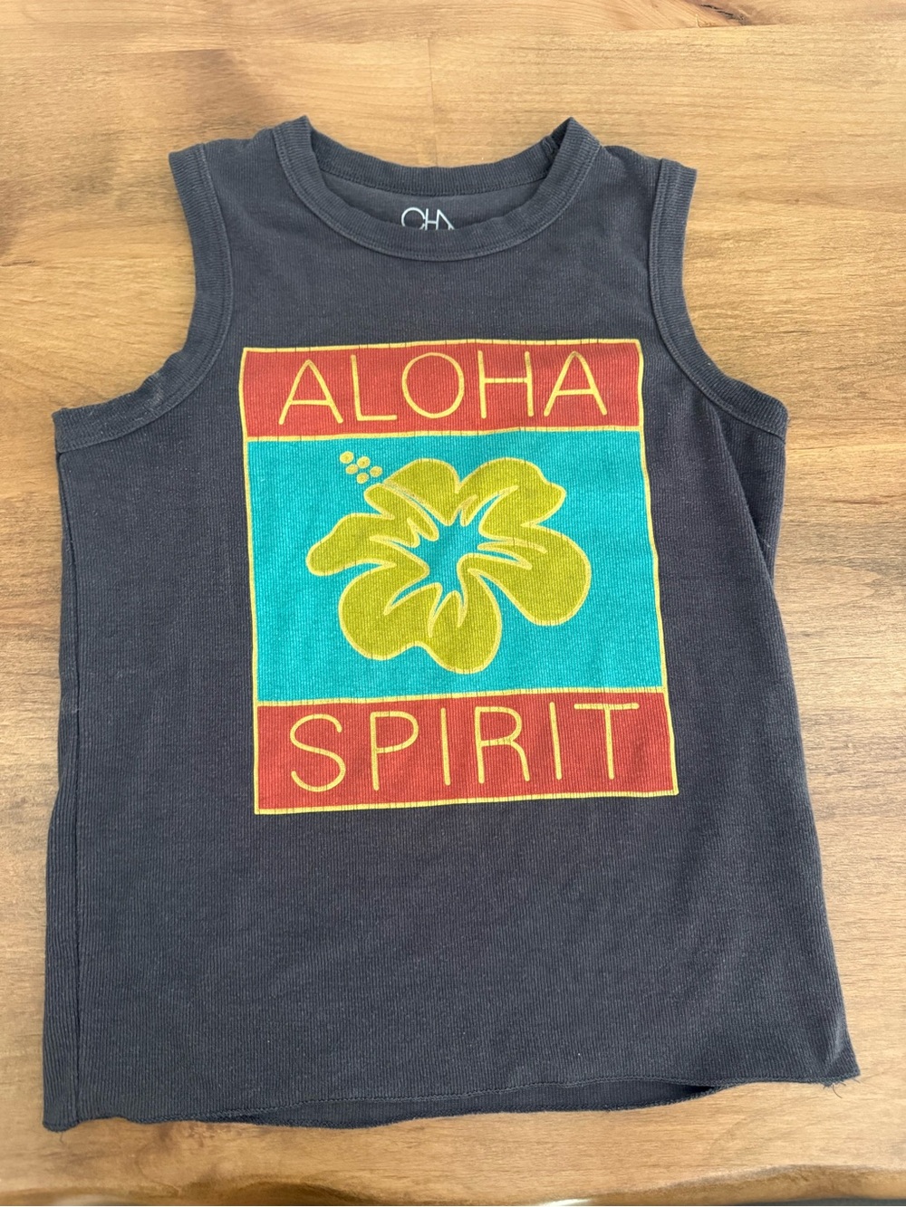Anthropologie Black Muscle Tee with Turquoise Panel and Yellow Hibiscus